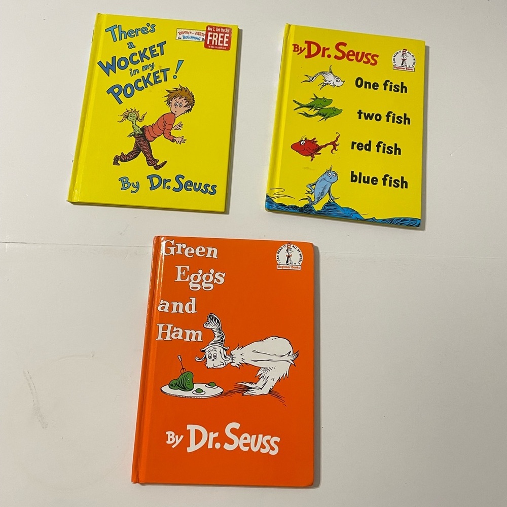 Three Dr. Seuss Books in hardcover. Green Eggs, One Fish, There's a Wocket in…